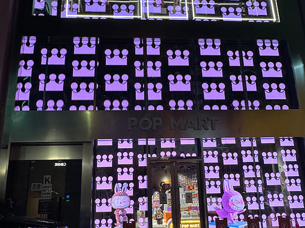 Transparent Holographic LED Display Brings Futuristic Ambiance to Pop Mart Retail